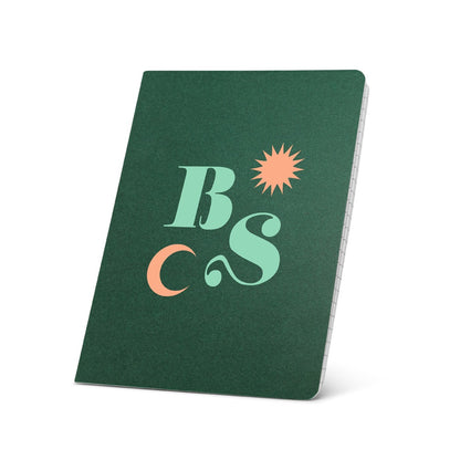 ECOWN promotional notebook in dark green with custom logo branding